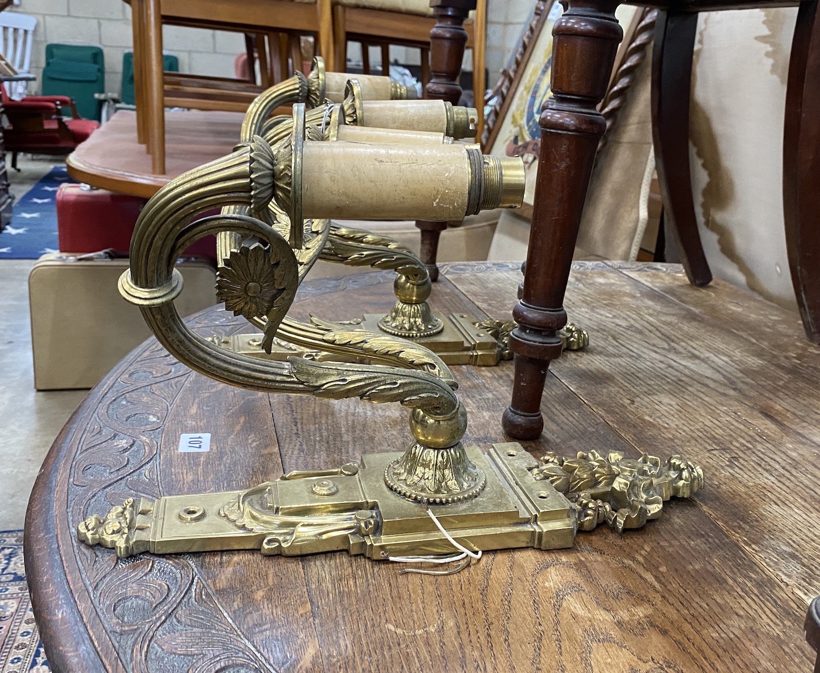 A pair of brass twin branch ormolu wall lights, height 42cm